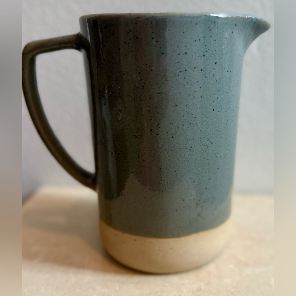 Stoneware ceramic pitcher. Possibly an artisan piece. 
7.25”H